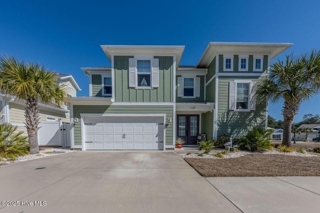 view of front of property featuring a garage, driveway, and board and batten siding