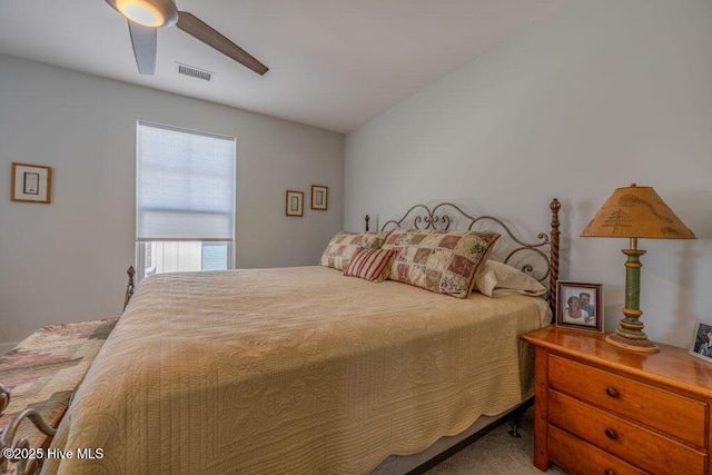 bedroom featuring ceiling fan, carpet flooring, and visible vents