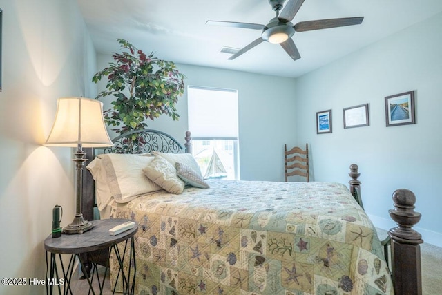 bedroom featuring carpet, ceiling fan, visible vents, and baseboards