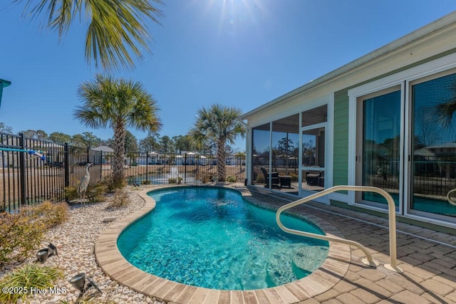 view of swimming pool with a fenced backyard, a fenced in pool, and a patio