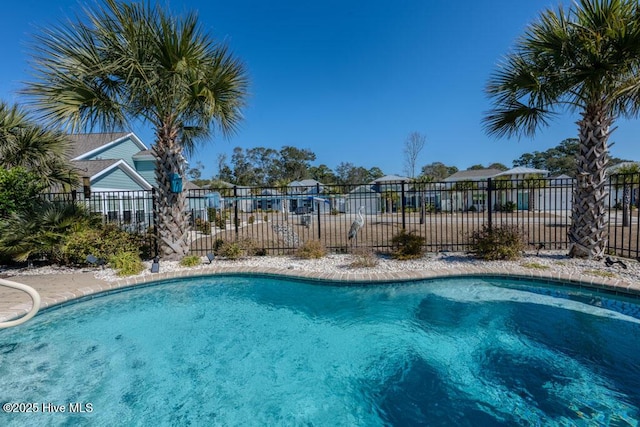 view of swimming pool with fence and a fenced in pool