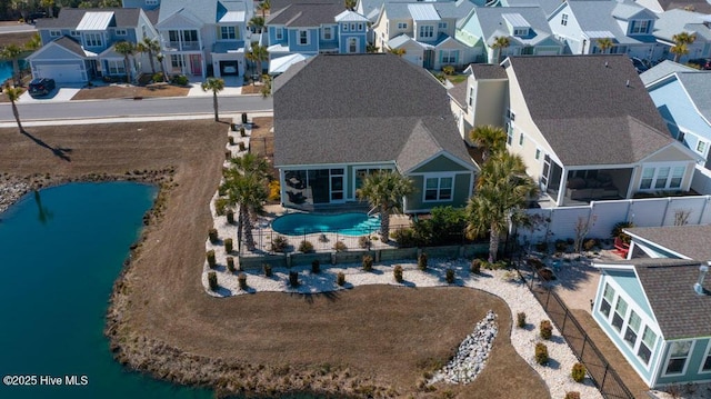 bird's eye view featuring a water view and a residential view