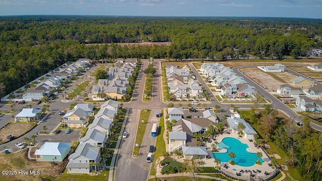 birds eye view of property featuring a residential view and a view of trees