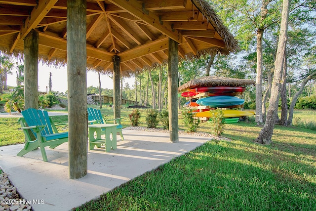 view of community featuring a gazebo, a yard, and a patio area