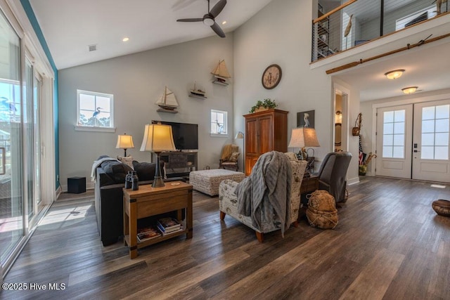 living room featuring dark wood-style floors, high vaulted ceiling, french doors, and a ceiling fan