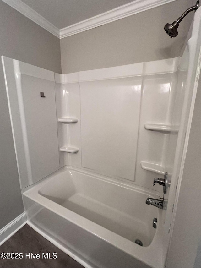 full bath featuring ornamental molding and shower / bathing tub combination