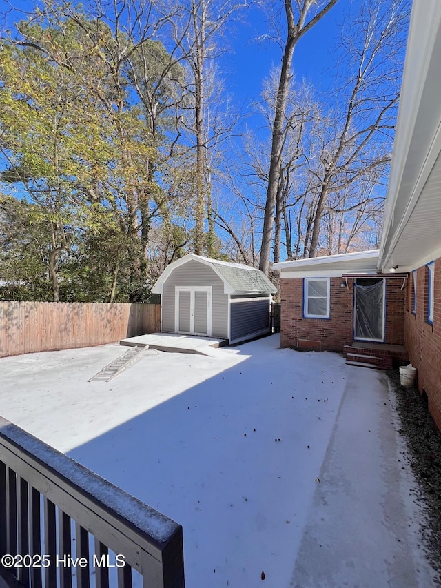 view of yard with an outbuilding, fence, and entry steps