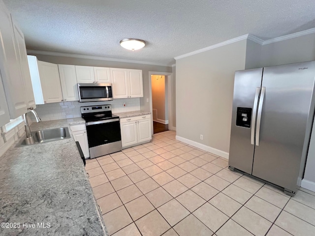 kitchen featuring a sink, white cabinetry, appliances with stainless steel finishes, tasteful backsplash, and crown molding