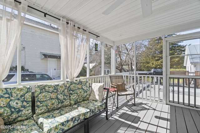 sunroom with a ceiling fan