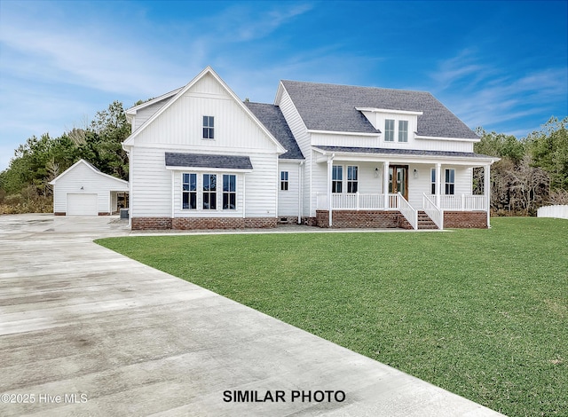 modern inspired farmhouse featuring roof with shingles, covered porch, a garage, an outdoor structure, and a front lawn