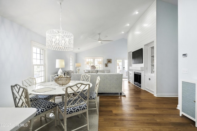 212 Florida Ave, Carolina Beach, NC 28428 - dining room featuring lofted ceiling, dark wood-style floors, a chandelier, plenty of natural light, and recessed lighting