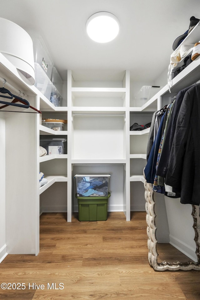 212 Florida Ave, Carolina Beach, NC 28428 - walk in closet with wood finished floors