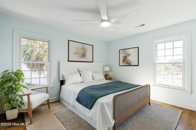 212 Florida Ave, Carolina Beach, NC 28428 - bedroom featuring light wood-style flooring, ceiling fan, and baseboards