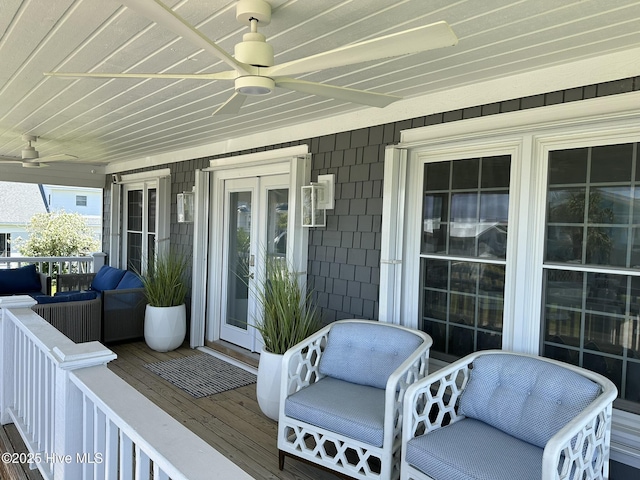 212 Florida Ave, Carolina Beach, NC 28428 - wooden porch featuring ceiling fan and french doors