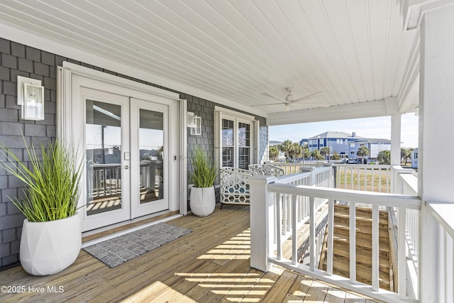 212 Florida Ave, Carolina Beach, NC 28428 - deck with french doors and ceiling fan