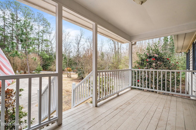 wooden terrace featuring covered porch