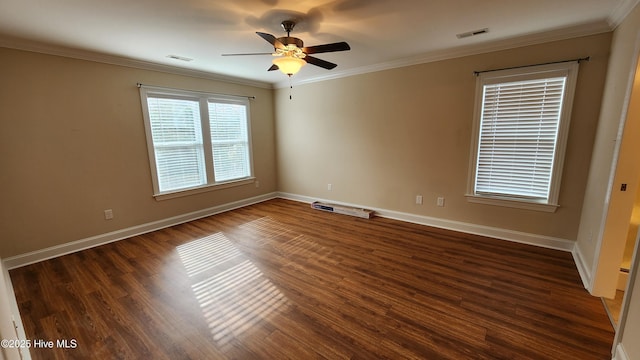 unfurnished room featuring baseboards, dark wood-style flooring, visible vents, and crown molding