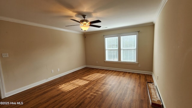 empty room with dark wood-style floors, ceiling fan, baseboards, and ornamental molding