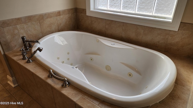 full bathroom featuring tile patterned flooring and a tub with jets