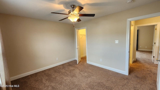 unfurnished bedroom with light colored carpet, ceiling fan, and baseboards