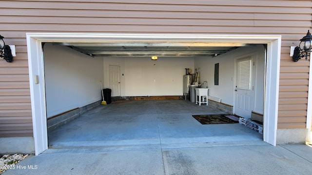 garage featuring water heater and a sink