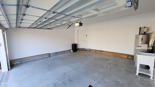 garage featuring water heater and a garage door opener