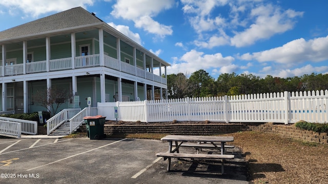 exterior space featuring stairs and fence