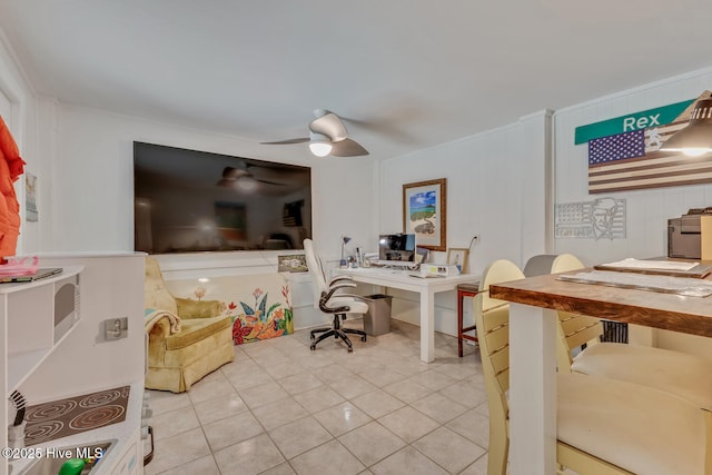 home office with a ceiling fan and tile patterned flooring