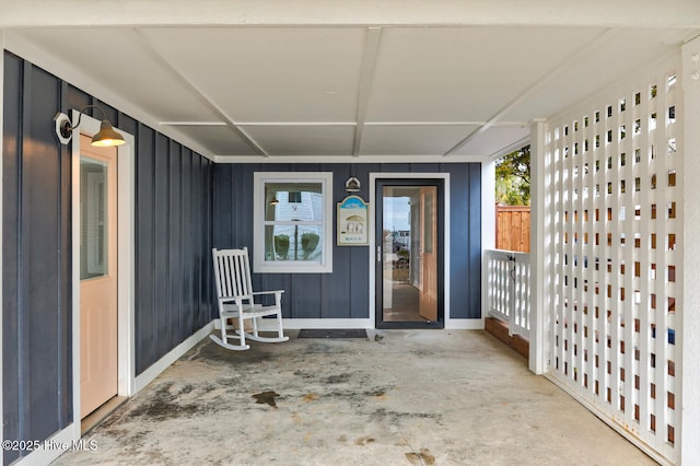 property entrance featuring board and batten siding