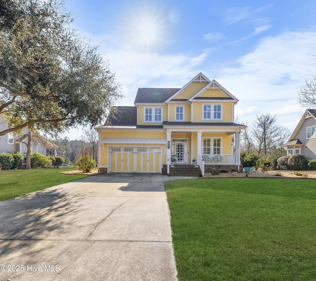 craftsman-style house with covered porch, driveway, a front yard, and a garage