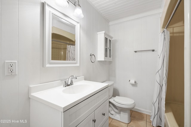 full bathroom with toilet, curtained shower, tile patterned flooring, and vanity