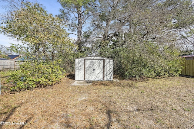 view of shed with fence