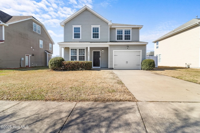 traditional home with a garage, driveway, and a front lawn