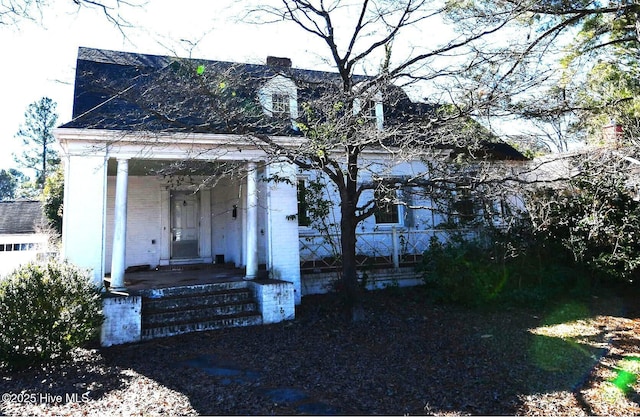 view of front of home featuring brick siding