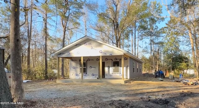 property in mid-construction with covered porch