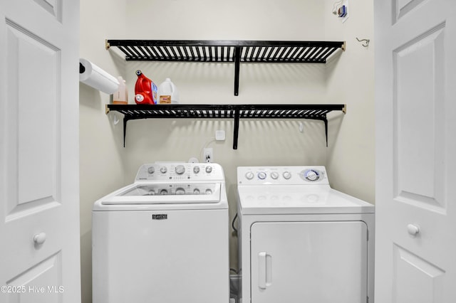 laundry area featuring washing machine and dryer and laundry area