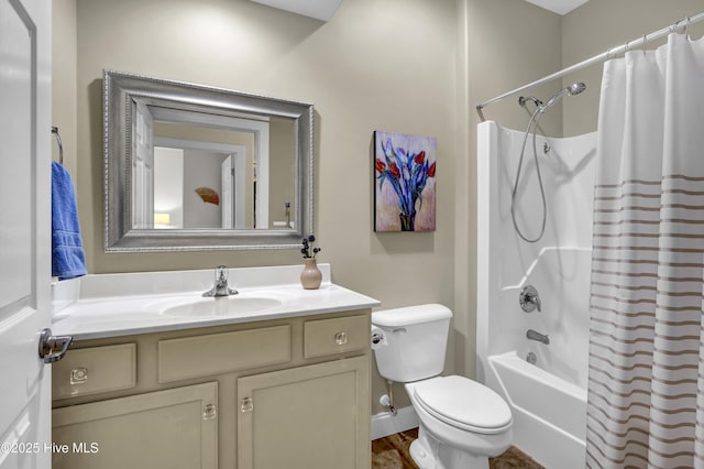 bathroom featuring vanity, toilet, and shower / bath combo with shower curtain