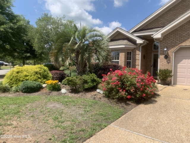 view of yard featuring a garage