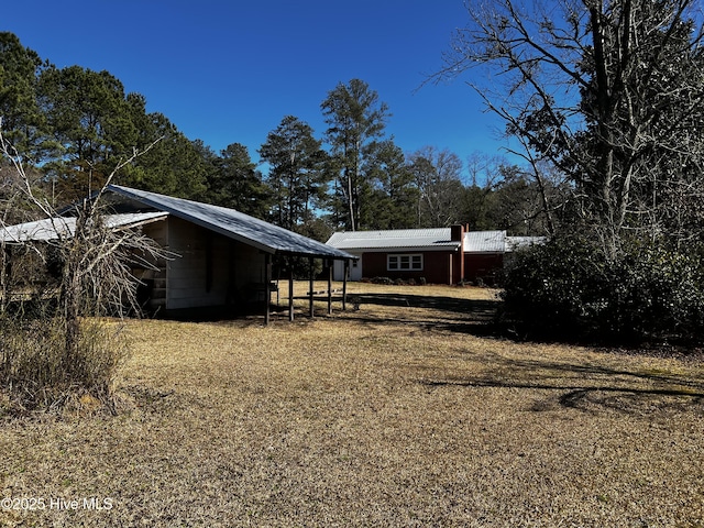 view of home's exterior featuring a detached carport