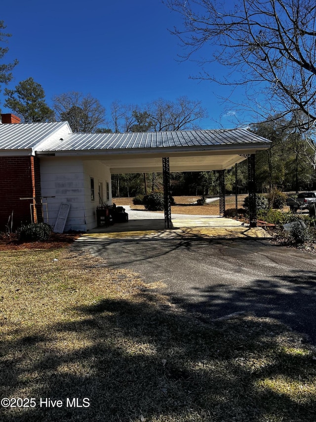 323 Hoover Rd, White Oak, NC 28399 - view of car parking with an attached carport