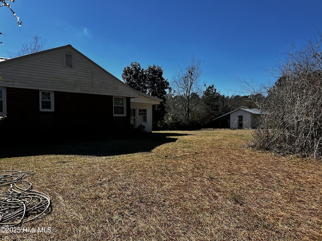 view of property exterior featuring a lawn