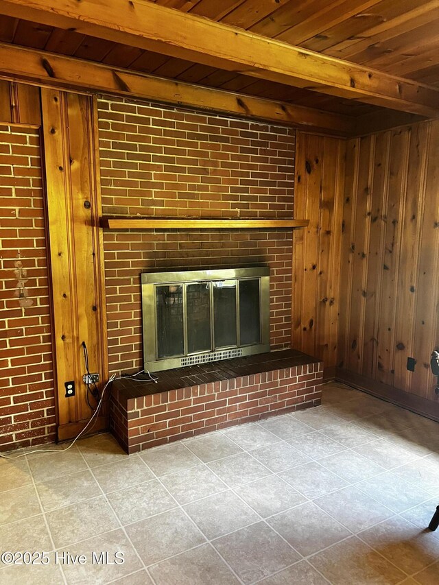 323 Hoover Rd, White Oak, NC 28399 - unfurnished living room with a fireplace, wood ceiling, wooden walls, beamed ceiling, and tile patterned flooring