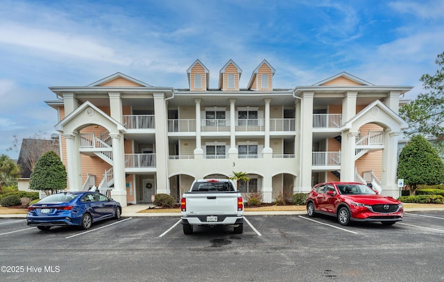 view of property with uncovered parking