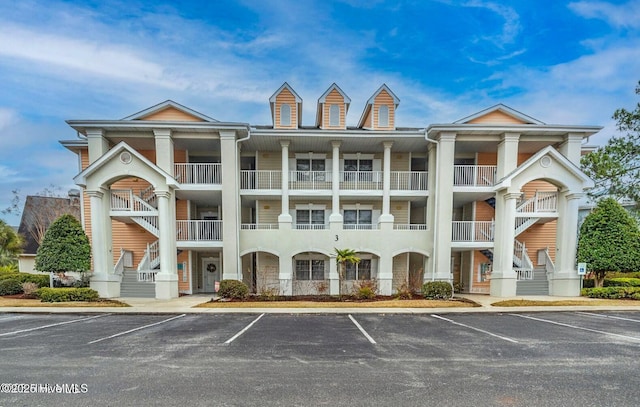 view of property with uncovered parking