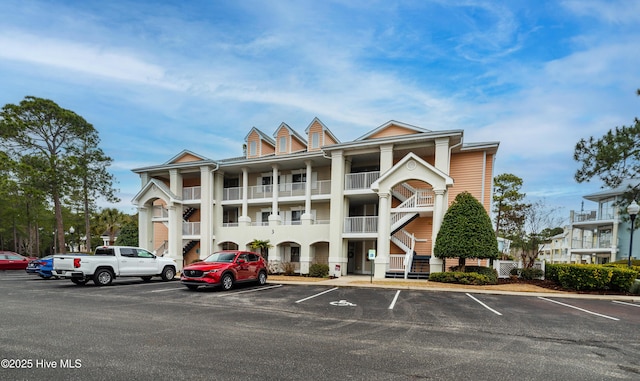 view of property featuring uncovered parking