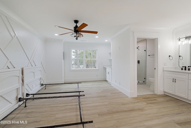 interior space featuring light wood-style flooring, crown molding, and recessed lighting