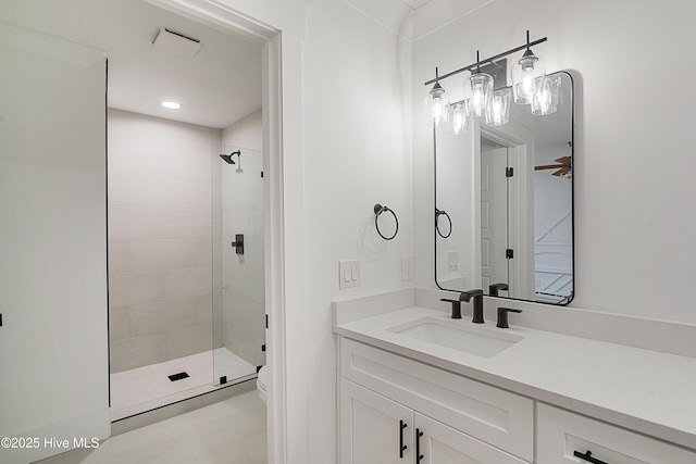 bathroom featuring recessed lighting, a shower stall, and vanity