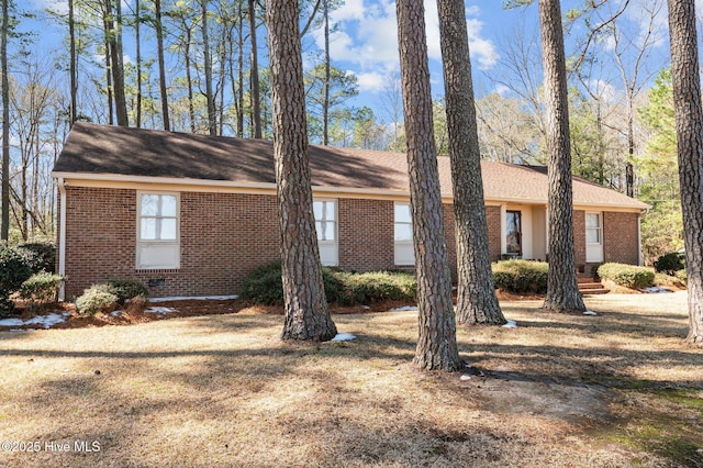 exterior space with brick siding