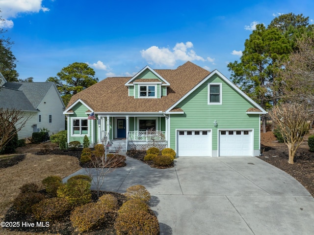 view of front facade featuring an attached garage, a porch, driveway, and a shingled roof