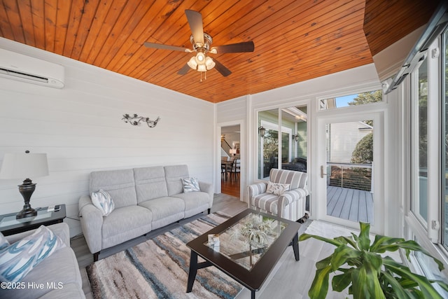 sunroom / solarium with wooden ceiling, a ceiling fan, and a wall unit AC